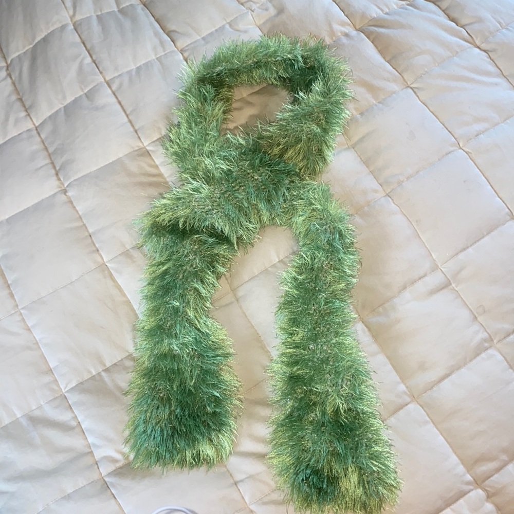 Knitted scarf. A glittery khaki knit with the lime green fur.